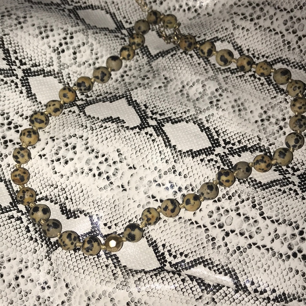 A cute tan/black cow print choker!